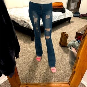 Distressed denim bootcut jeans